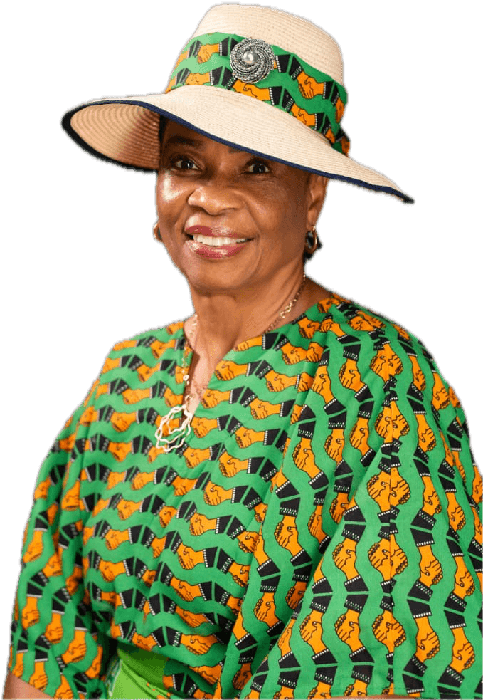 Ambassador Nkoyo Esu Toyo in a straw hat and green ADC-print outfit, smiling