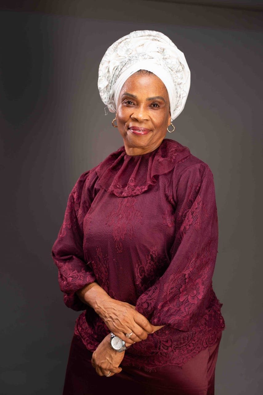 Ambassador Nkoyo Esu Toyo in burgundy lace and a white head wrap